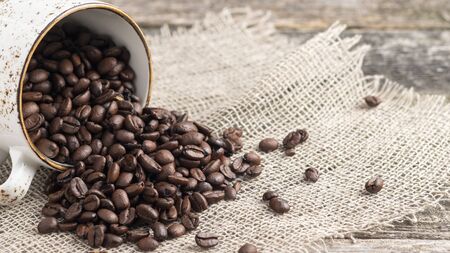 Coffee cup full of coffee beans with copy space.の写真素材