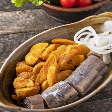 Herring with baked potato and onionの写真素材