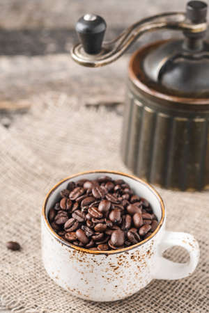 Delicious coffee beans in a cup.