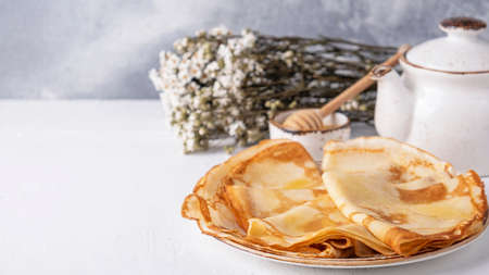 Tasty thin pancakes on a plate. Breakfast concept. Text space