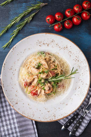 Pasta with chicken, vegetables and cheese. Top view
