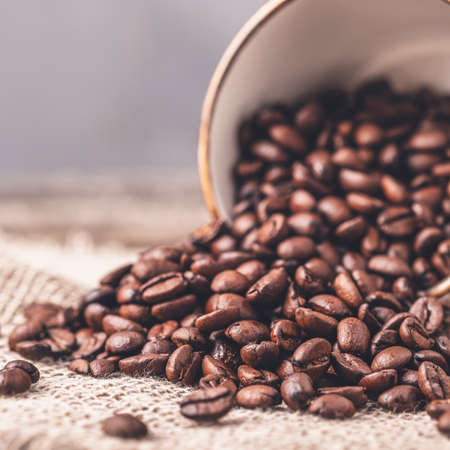 Toned photo of coffee cup with coffee beans. Closeupの写真素材