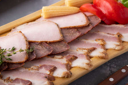 Macro view of smoked meat with marinated vegetables. Closeup