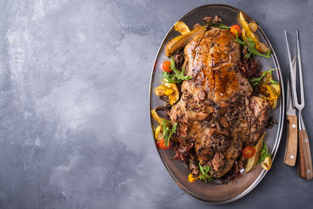 Tasty baked duck stuffed with buckwheat and mushrooms. Top view. Copy spaceの写真素材
