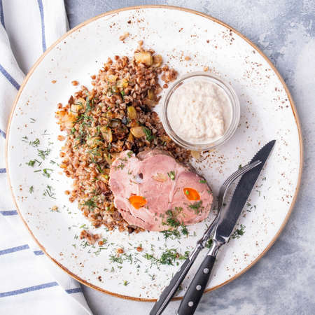 Closeup photo of boiled pork with buckwheat cereal. Top viewの写真素材
