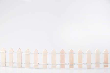 Small wooden fence on white background, Copy spaceの写真素材