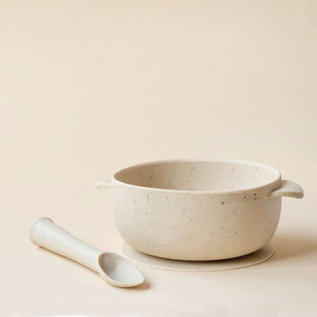 Baby silicone plate with spoon. First utensil for babyの写真素材