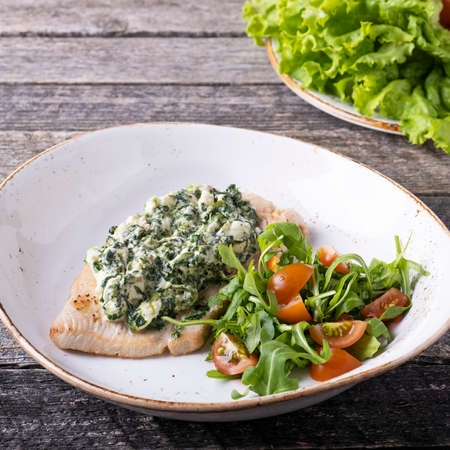 Baked turkey fillet with spinach and curd cheeseの写真素材