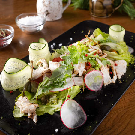 White fish salad with vegetablesの写真素材