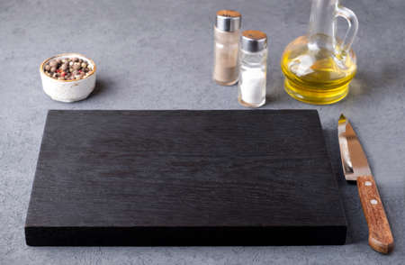 Empty wooden board with spices. Text space