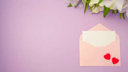Empty envelope and red hearts on color background. Valentine's day concept. Top view, copy spaceの写真素材