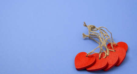 Valentines day symbol red hearts on violet background. Toned. Copy spaceの写真素材