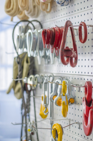 Demonstration booth with large red and yellow hooks for slings, verticalの写真素材