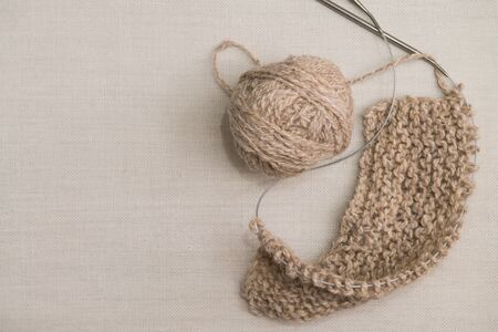 Beige fleece and knitting needles, beigeの写真素材
