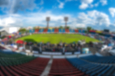 an open-air stadium, summer, green grass, blurred backgroundの写真素材