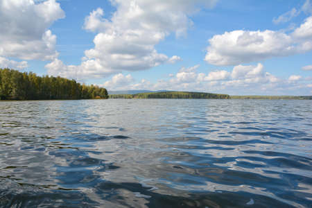 clear lake blue sky with cloudsの写真素材