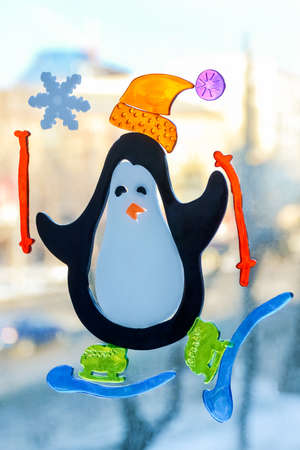 Children's colorful drawing on the window dedicated to the new year holidayの写真素材