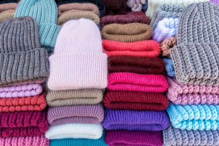 handmade knitted wool hats are sold at the street marketの写真素材