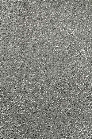 Smooth gray surface of the plastered wall close-up. The pattern and texture of the plaster.