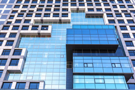The original facade of an office building in the city center. Urban architecture.