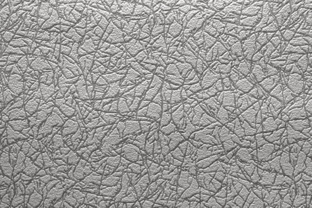Texture and pattern of gray vinyl wallpaper close-up. abstract background for designの写真素材