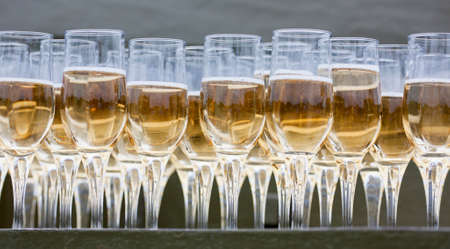 glasses with champagne on a tableの写真素材