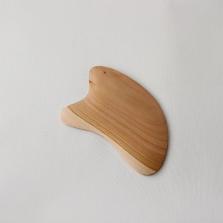 Body massager-Gua-sha. Lymphatic drainage for body and face. Subject photo. High quality photoの写真素材