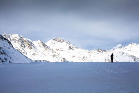 lonely man in the endless Alps in Innsbruckの写真素材