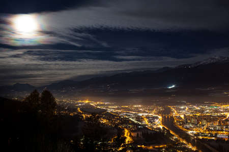 Full moon in Innsbruck, Austriaの写真素材