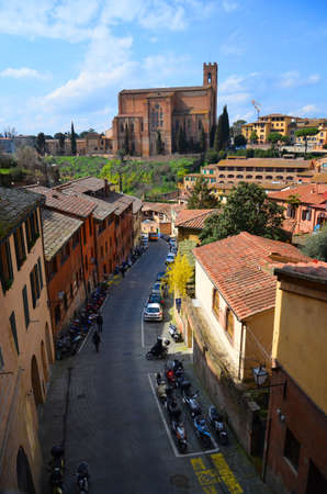 Picturesque old narrow street in Italy in Sienaの写真素材