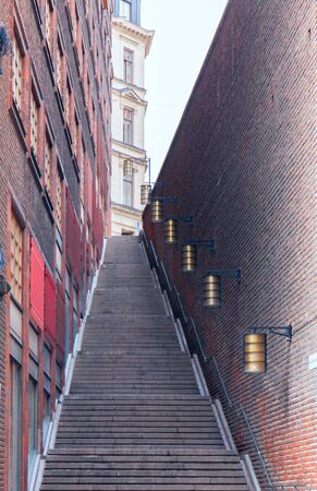 stone staircase in the city. The narrow street leading to the top. Vertocalの写真素材