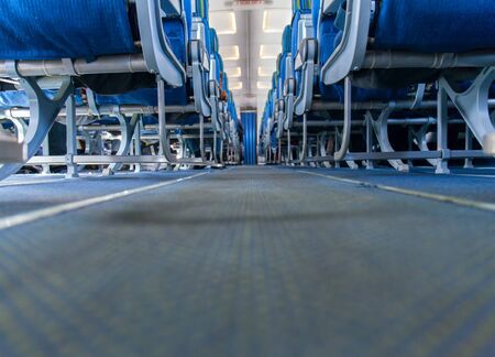 Airplane interior, passenger seat and aisle. stock photoの写真素材