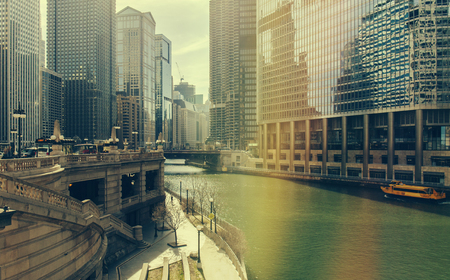 Chicago, Illinois, USA - July 19, 2016: Chicago skyscrapers, Watertaxi and Wendell sightseeing boat on the Chicago river, Donald Tramp Tower and Mather Tower in Chicago. Stock photoのeditorial素材
