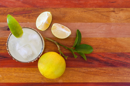 Key lime margarita garnished with fresh lime in a glass bar table. view from aboveの写真素材