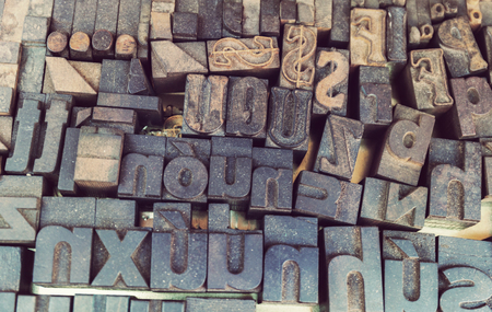 Old letterpress background, close up of many retro, random metal lettersの写真素材