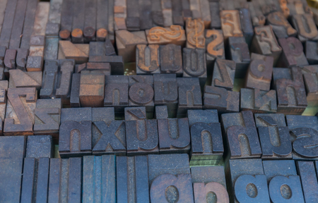 Old letterpress background, close up of many retro, random metal lettersの写真素材