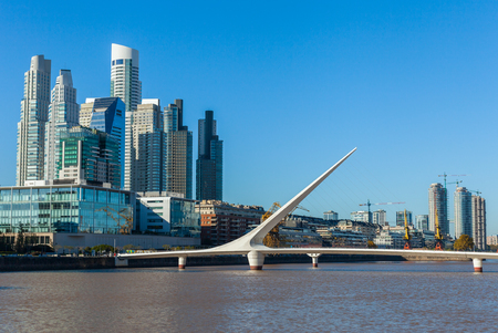 Buenos Aires city skyline. View of Puente de la Mujer Womens Bridge , Puerto Maderoの写真素材