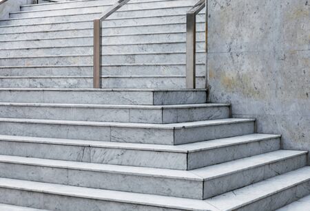Modern marble staircase of the municipal administrative building with stainless steel handrailsの写真素材