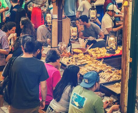 San Telmo market interior at Buenos Aires, Argentina. June 30, 2019. Empanada - typical local street food.のeditorial素材