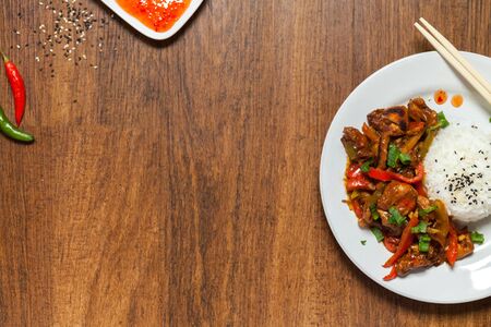 Sweet and Sour Chicken on Rice with chili pepper. Typical Asian dish. flat layout. A lot of negative space for text. Stock photoの写真素材