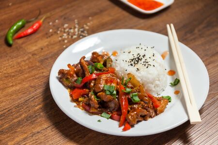 Sweet and Sour Chicken on Rice. Typical Asian dish. Stock photoの写真素材