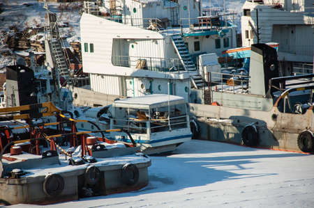 Ships of various types in the winter anchorage in the backwater named after Lenin. frost and sun wonderful day. Blagoveshchensk, Russian Federation.の写真素材