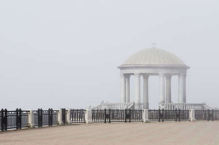 Scenic view of the marble rotunda with a balustrade on the foggy embankment of the city of Blagoveshchensk, Far East, Russia.の写真素材
