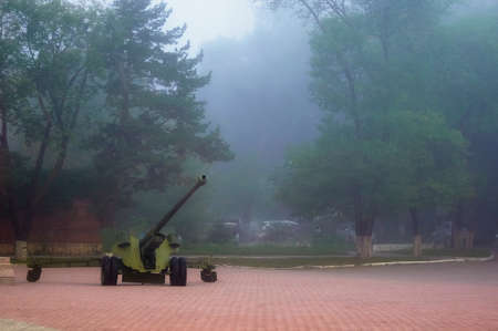 Old vintage mobile artillery vehicle - mobile military weapon with cannon. Armament from second world war. Gun is aiming to the skyの写真素材