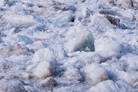 Melting river ice. Columnar and needle-like structure of crystals. Ice floe in the spring on the banks of the Amur River. Close view. Selective focus.の写真素材