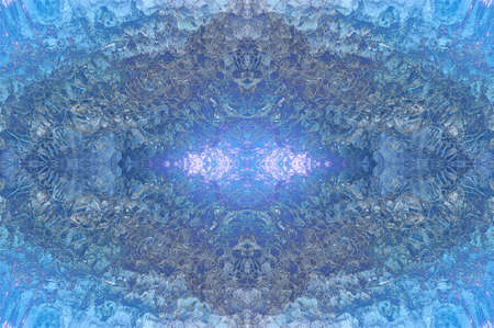 Beautiful seamless structured texture of blue color. Kaleidoscope of colored ice crystals. Winter background. Collage from natural river ice.の写真素材