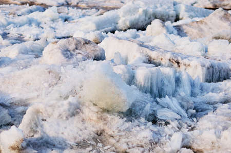 Ice structure of river hummocks in spring. Sharp ice needles on the banks of the Amur River. Selective focus. Blagoveshchensk, Russia.の写真素材