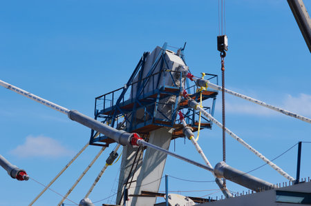A pylon of a modern cable-stayed bridge with an upper holder for cables and platforms. Construction of an automobile cable-stayed bridge across the Zeya River. Blagoveshchensk, Far East, Russia.の写真素材