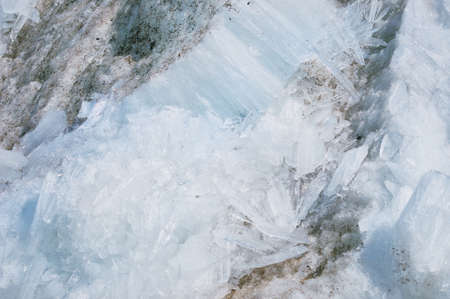 Melting river ice. Columnar and needle-like structure of crystals. Ice floe in the spring on the...