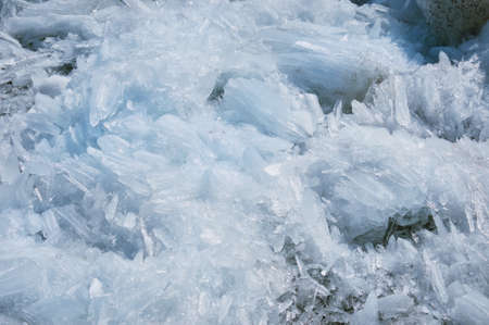Blocks of ice on the river in spring. Needle texture. Sunny day.